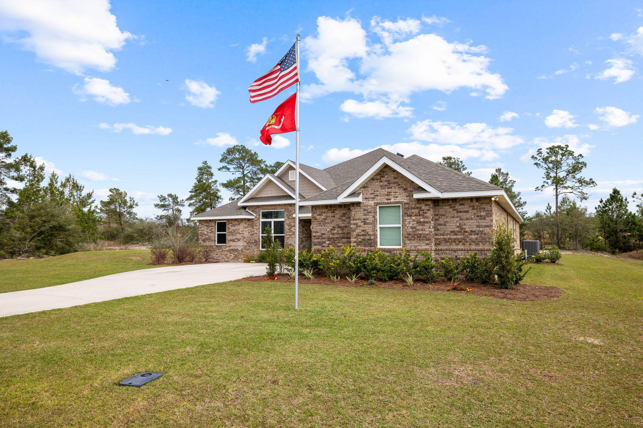 1297 Brushed Dune Circle Freeport, FL 32439 - Photo 3 of 73 a view of an house with backyard and garden