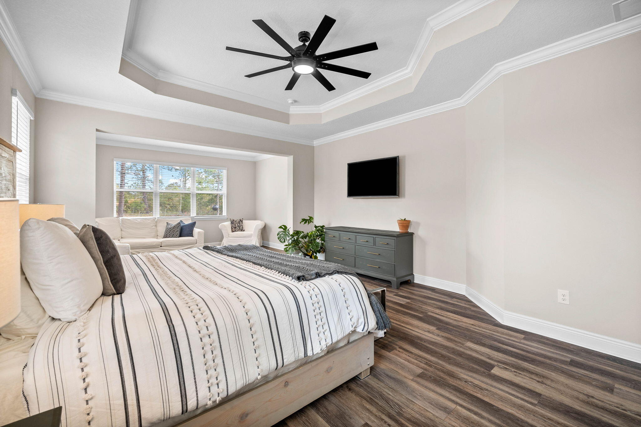 1297 Brushed Dune Circle Freeport, FL 32439 - Photo 30 of 73 a spacious bedroom with a bed and a flat screen tv