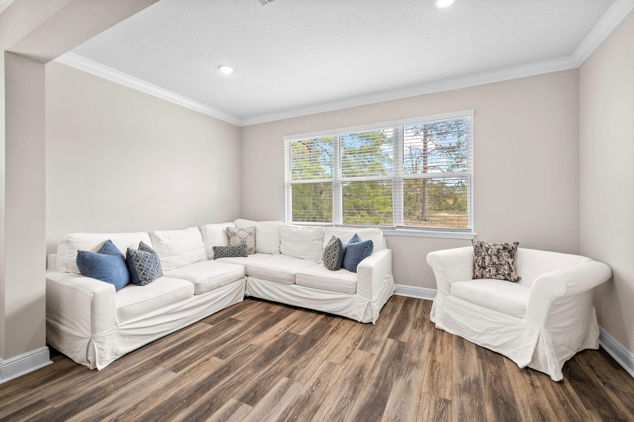 1297 Brushed Dune Circle Freeport, FL 32439 - Photo 31 of 73 a living room with furniture and a large window