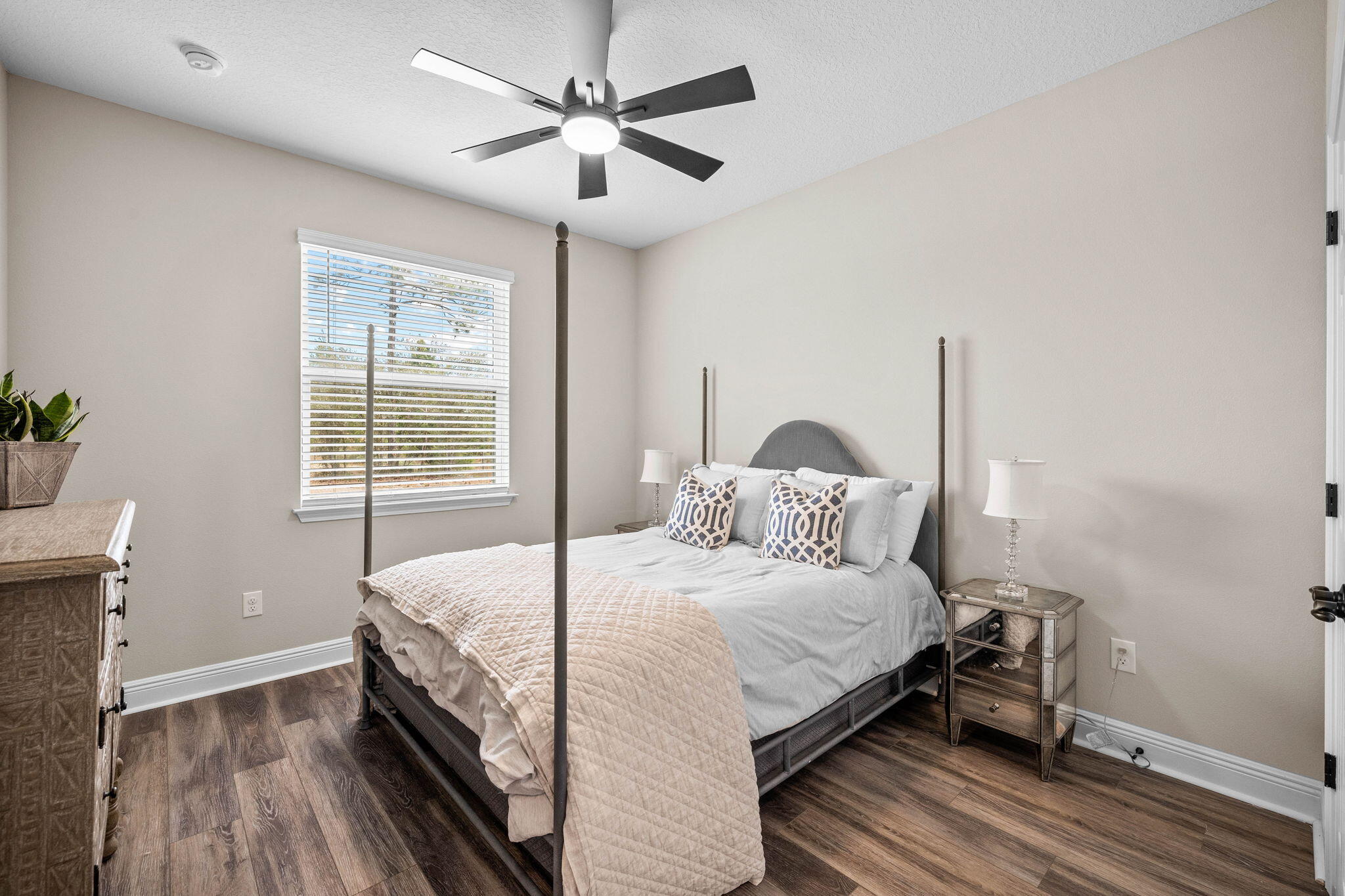 1297 Brushed Dune Circle Freeport, FL 32439 - Photo 40 of 73 a bedroom with a bed and a chandelier