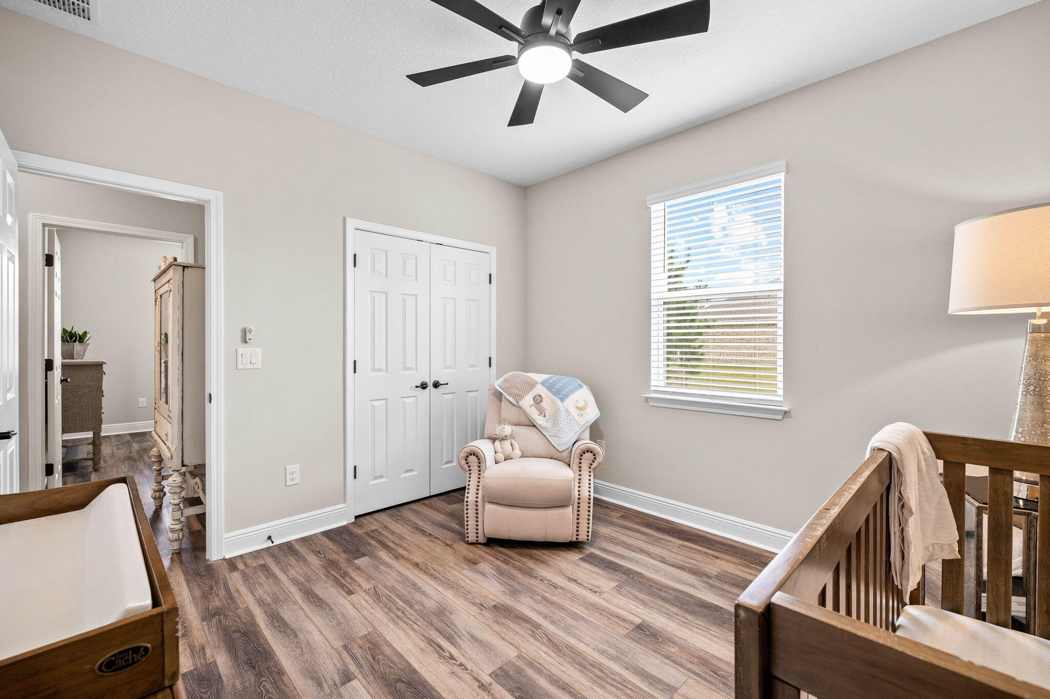 1297 Brushed Dune Circle Freeport, FL 32439 - Photo 43 of 73 a bedroom with furniture window and a ceiling fan