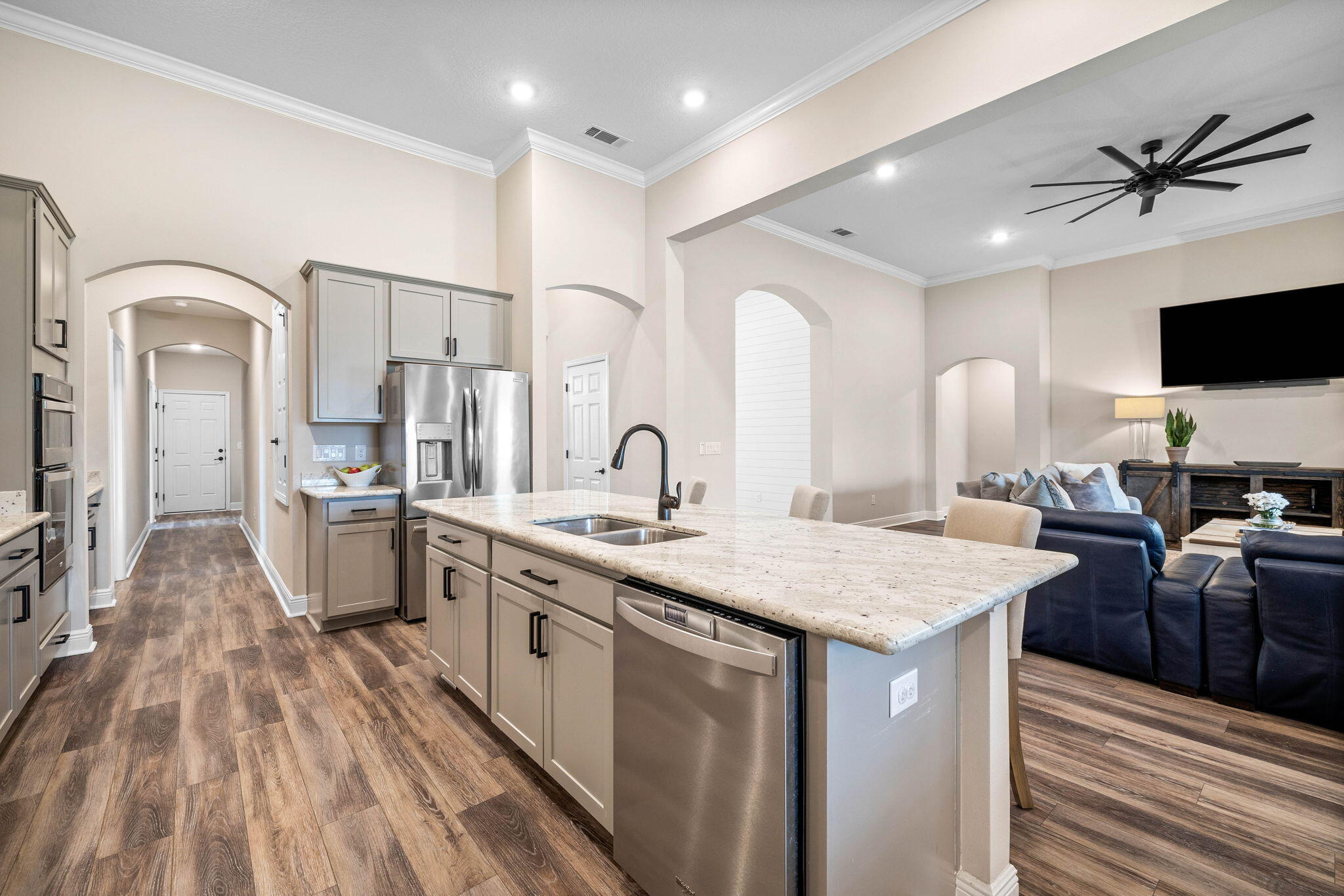 1297 Brushed Dune Circle Freeport, FL 32439 - Photo 44 of 73 a large white kitchen with sink a refrigerator and furniture