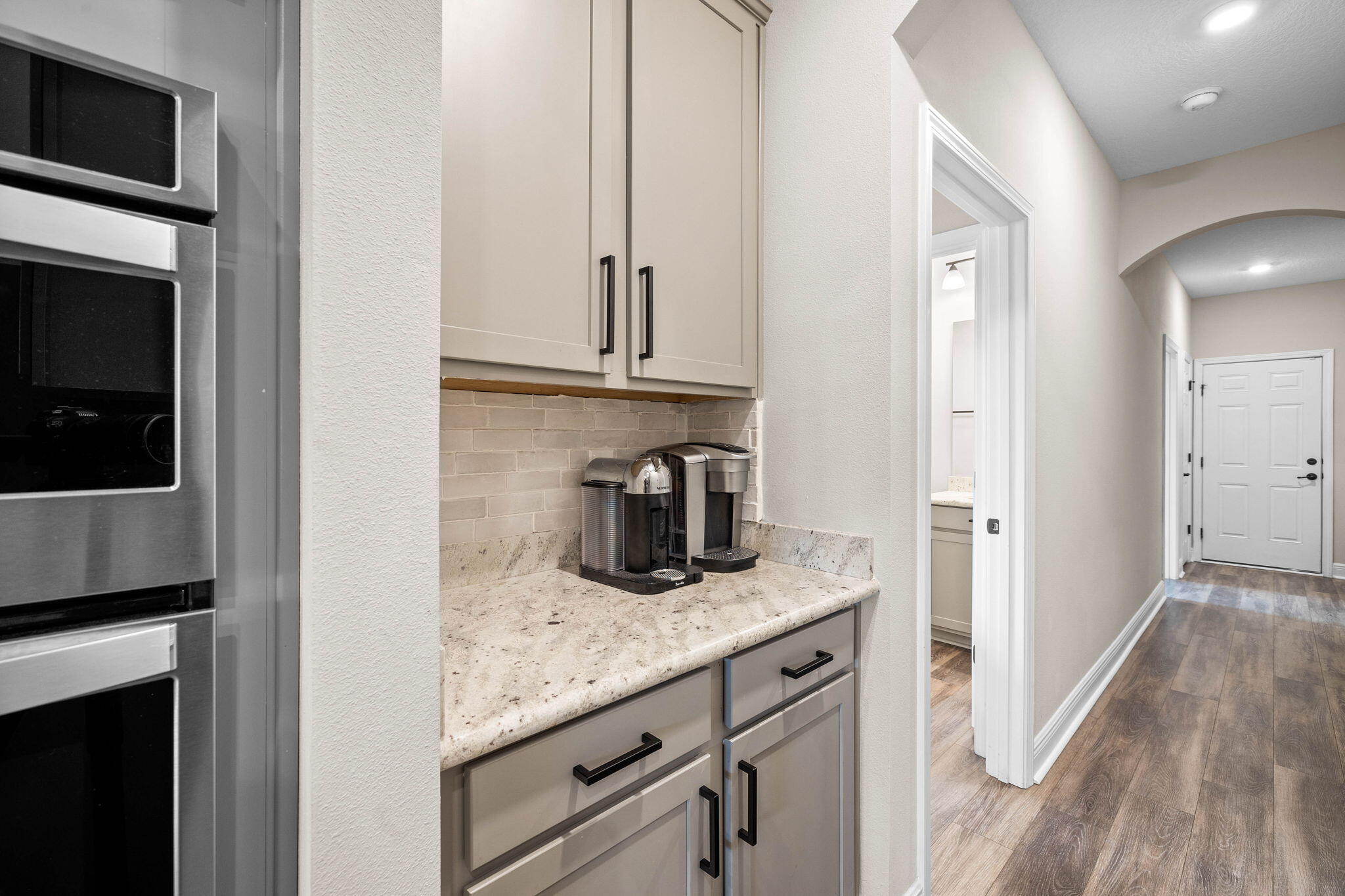 1297 Brushed Dune Circle Freeport, FL 32439 - Photo 45 of 73 a kitchen with granite countertop cabinets stainless steel appliances and a counter space
