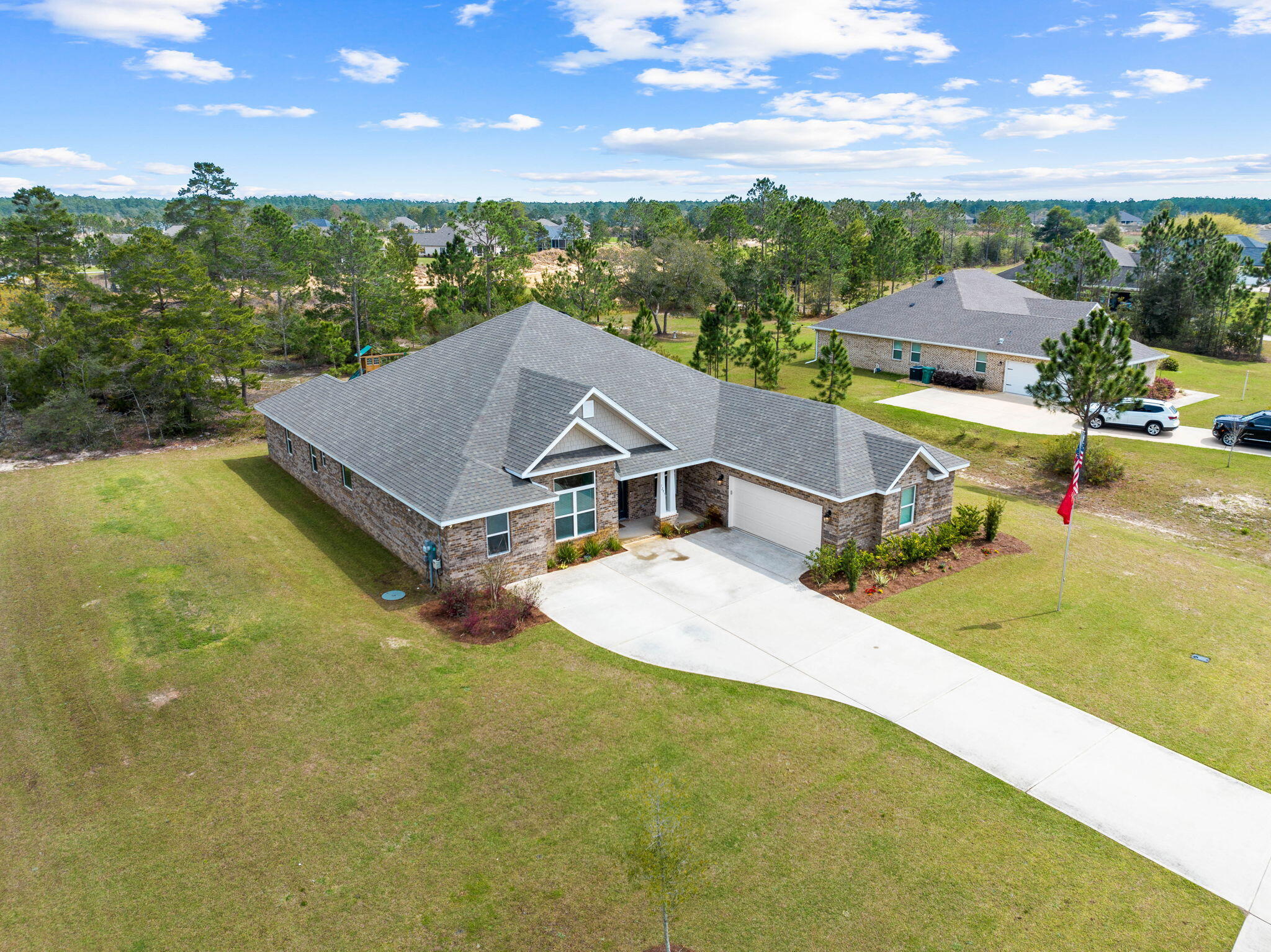 1297 Brushed Dune Circle Freeport, FL 32439 - Photo 7 of 73 an aerial view of a house with swimming pool and green space