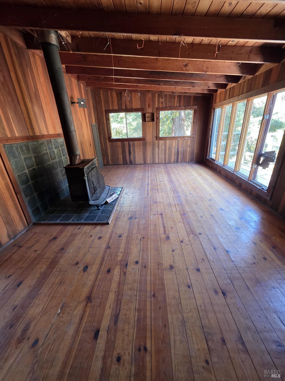 13333 Low Gap Road Ukiah, CA 95482 - Photo 18 of 50 a view of an empty room with wooden floor and a window