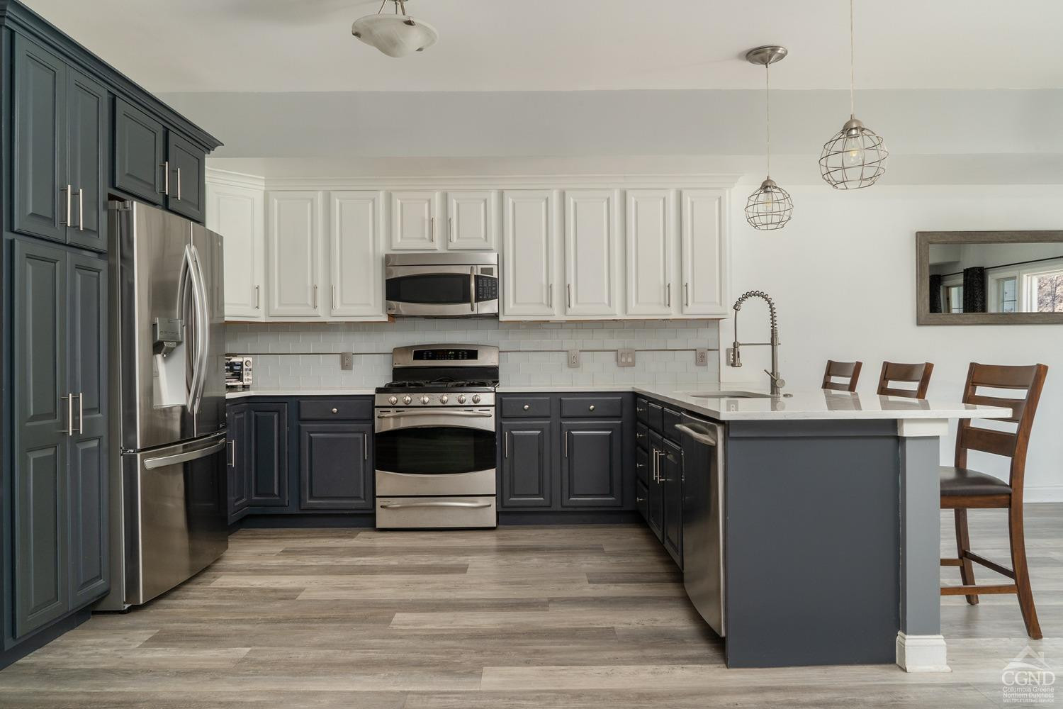 19 Marina Drive Catskill, NY 12414 - Photo 3 of 10 a kitchen with granite countertop a refrigerator stove and microwave