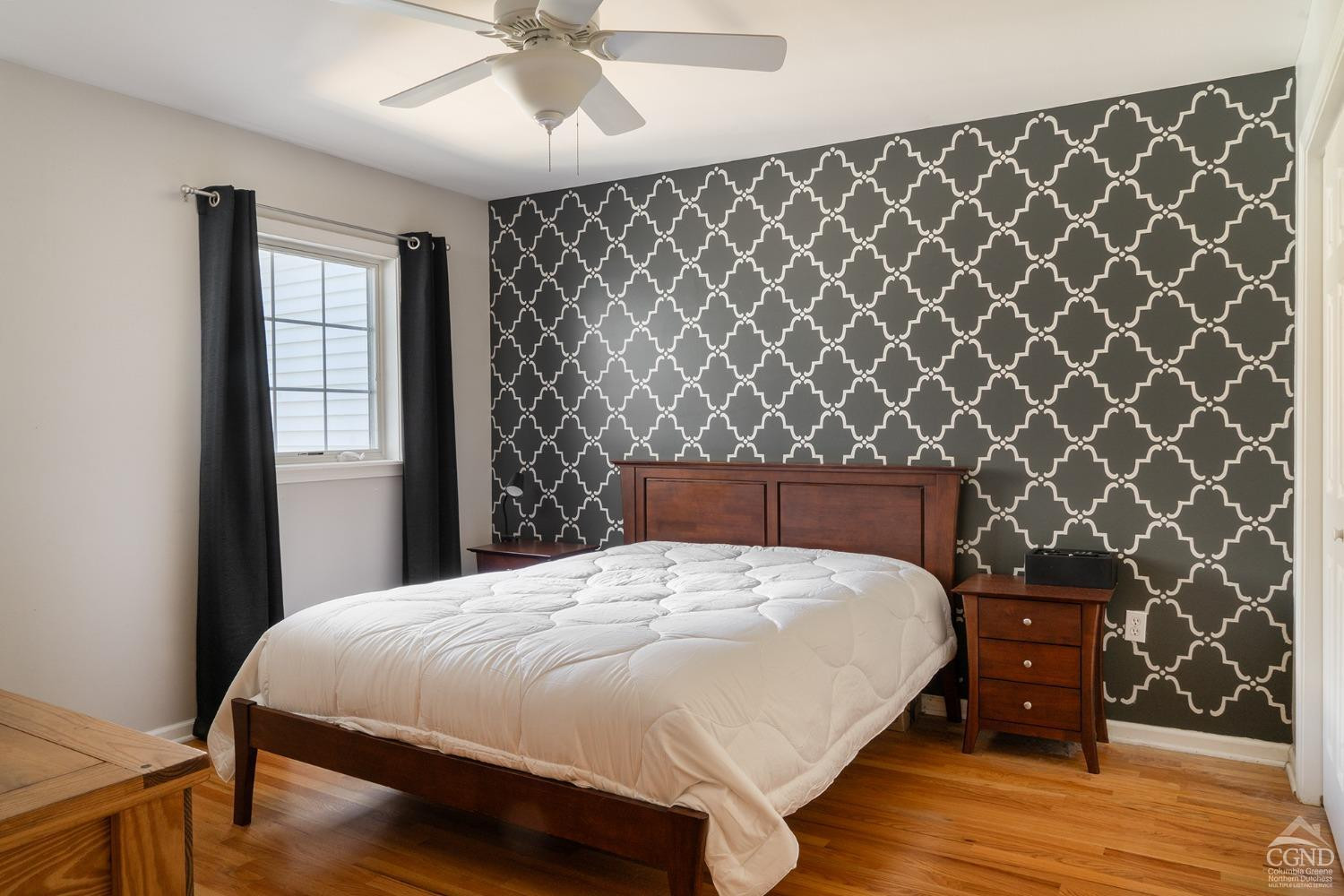 19 Marina Drive Catskill, NY 12414 - Photo 6 of 10 a bedroom with a bed and a dresser with wooden floor