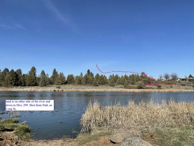 a view of a lake with houses in the background