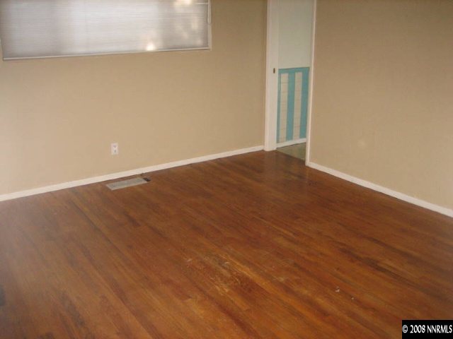 1855 Watt Street Reno, NV 89509 - Photo 4 of 5 an empty room with wooden floor