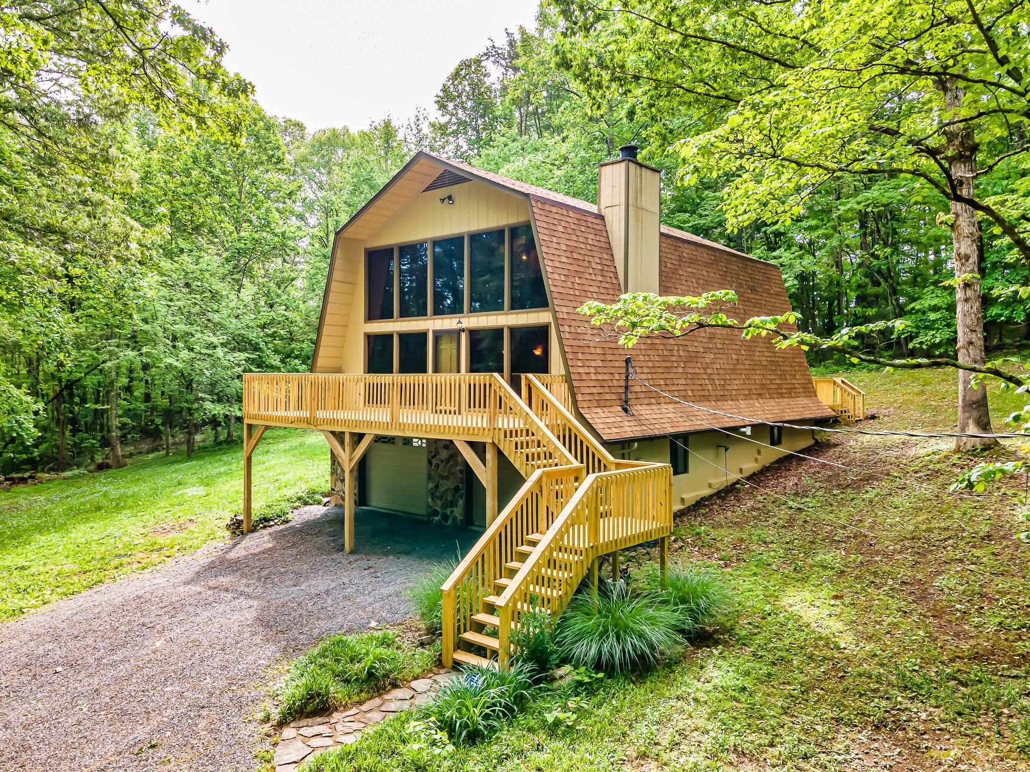 916 Gamble Drive Heiskell, TN 37754 - Photo 1 of 29 an aerial view of a house with a yard table and chairs