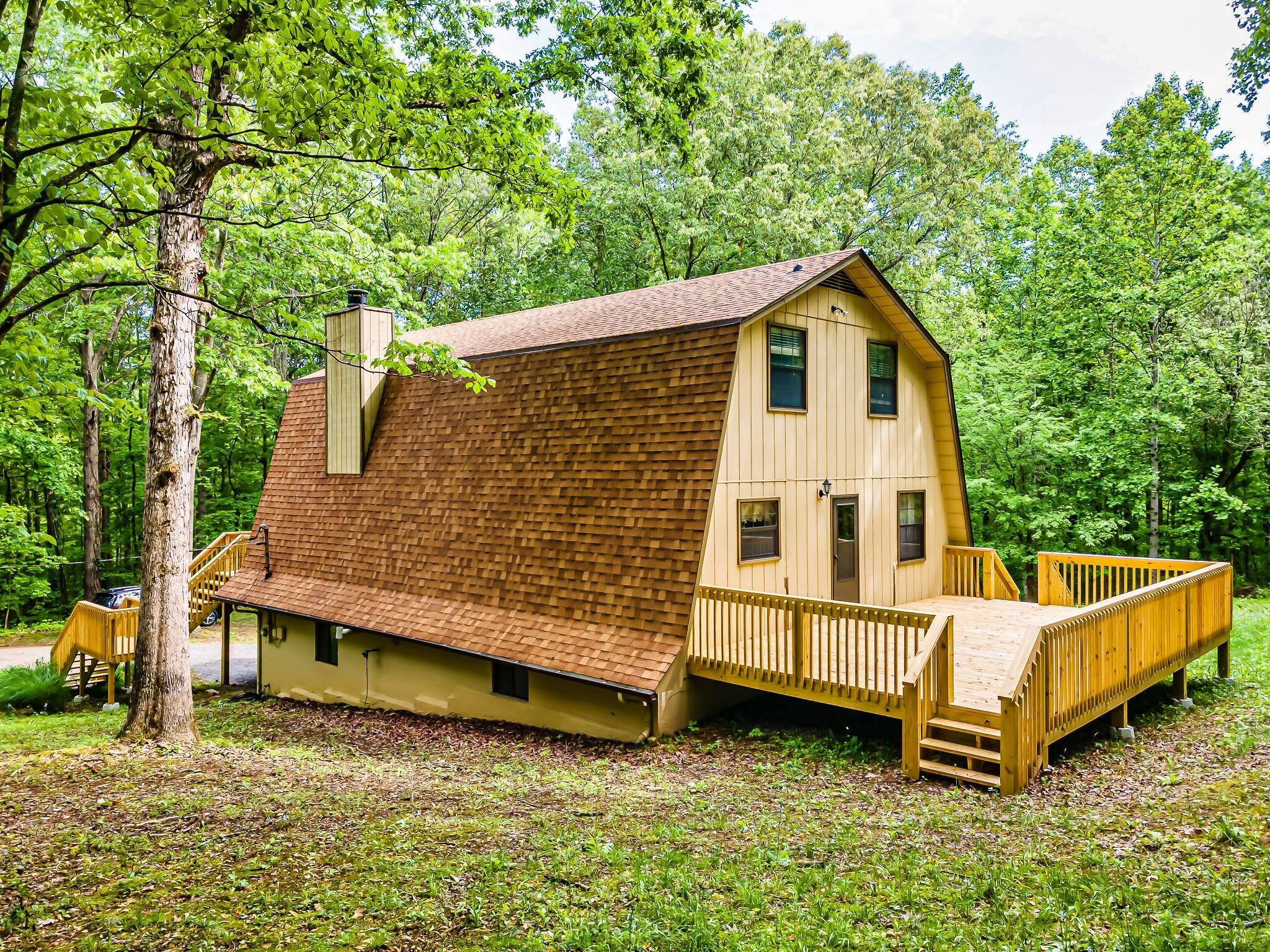 916 Gamble Drive Heiskell, TN 37754 - Photo 28 of 29 a view of a house with a yard chairs and wooden fence