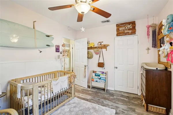 a bedroom with a bed and dresser