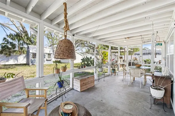 a view of a backyard with sitting area and furniture