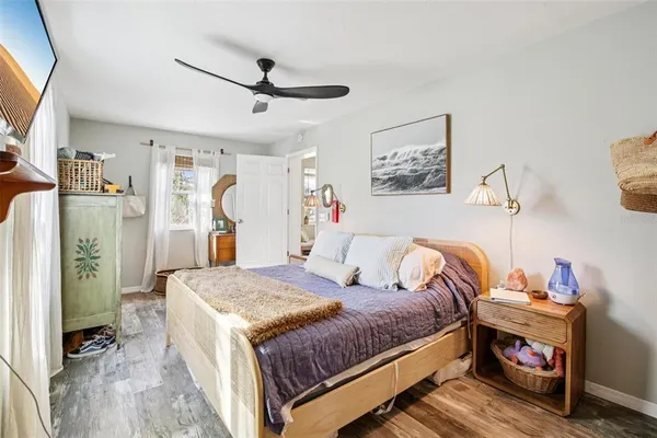 a bedroom with a bed and a table