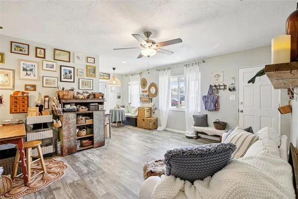 a living room with furniture and a bookshelf