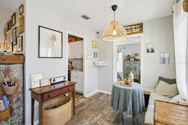 a very nice looking room with many windows and furniture
