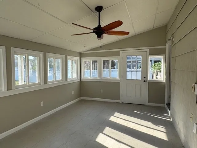 a view of an empty room with a window