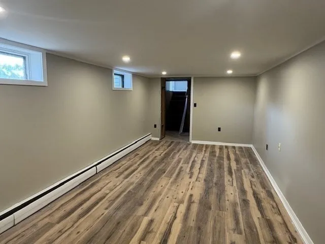 a white toilet sitting next to a bathroom sink