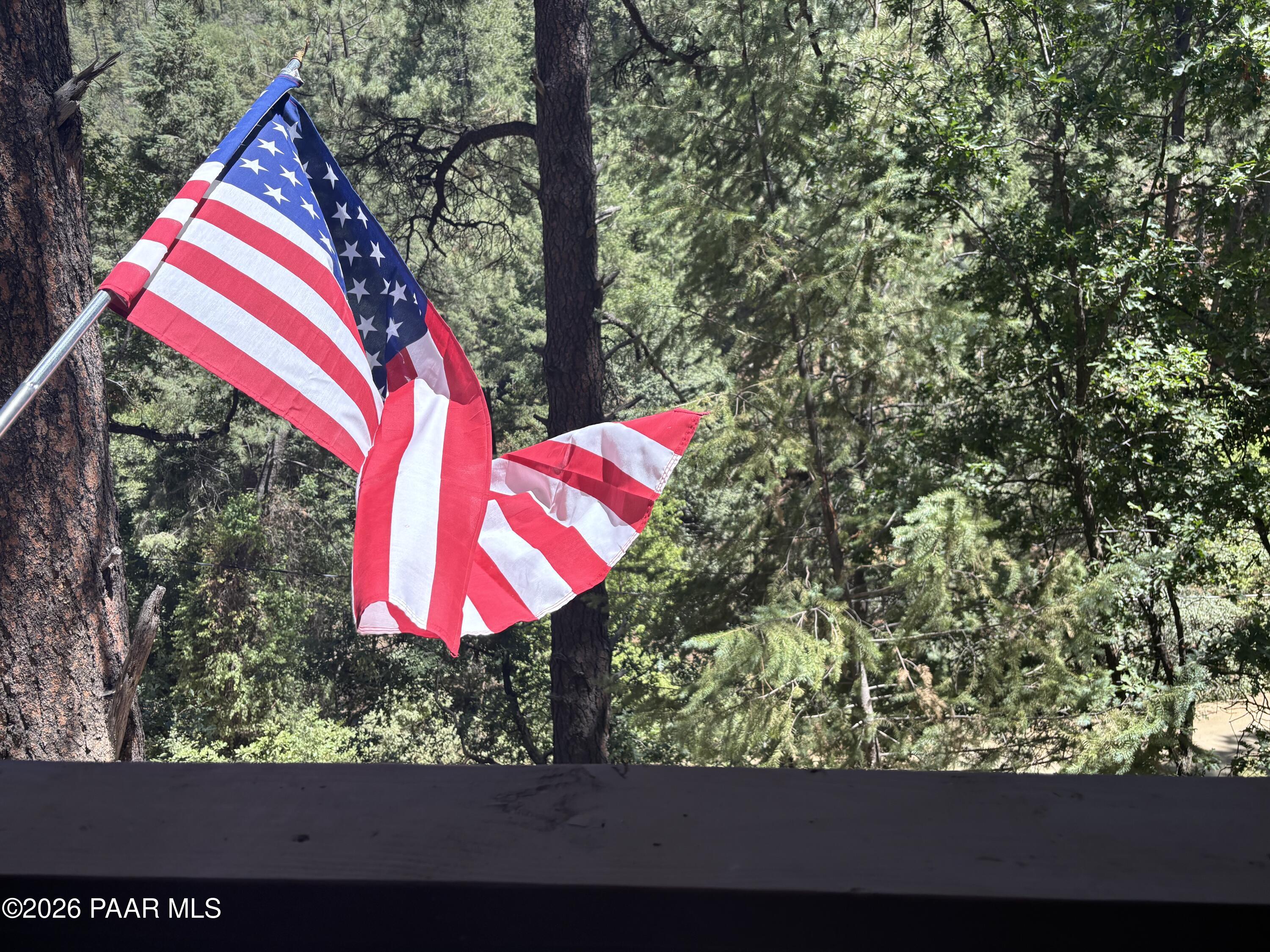 8550 South Breezy Pine Road Mayer, AZ 86333 - Photo 13 of 40 a view of a backyard with red and white house