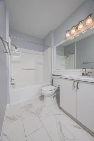 a view of a green field with lots of bushes