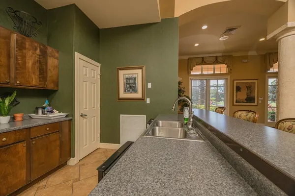 a view of a chairs and table in a patio