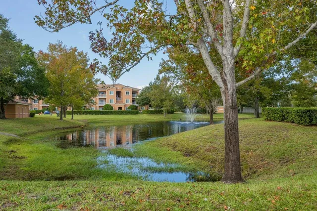 a view of a lake with a house in the background