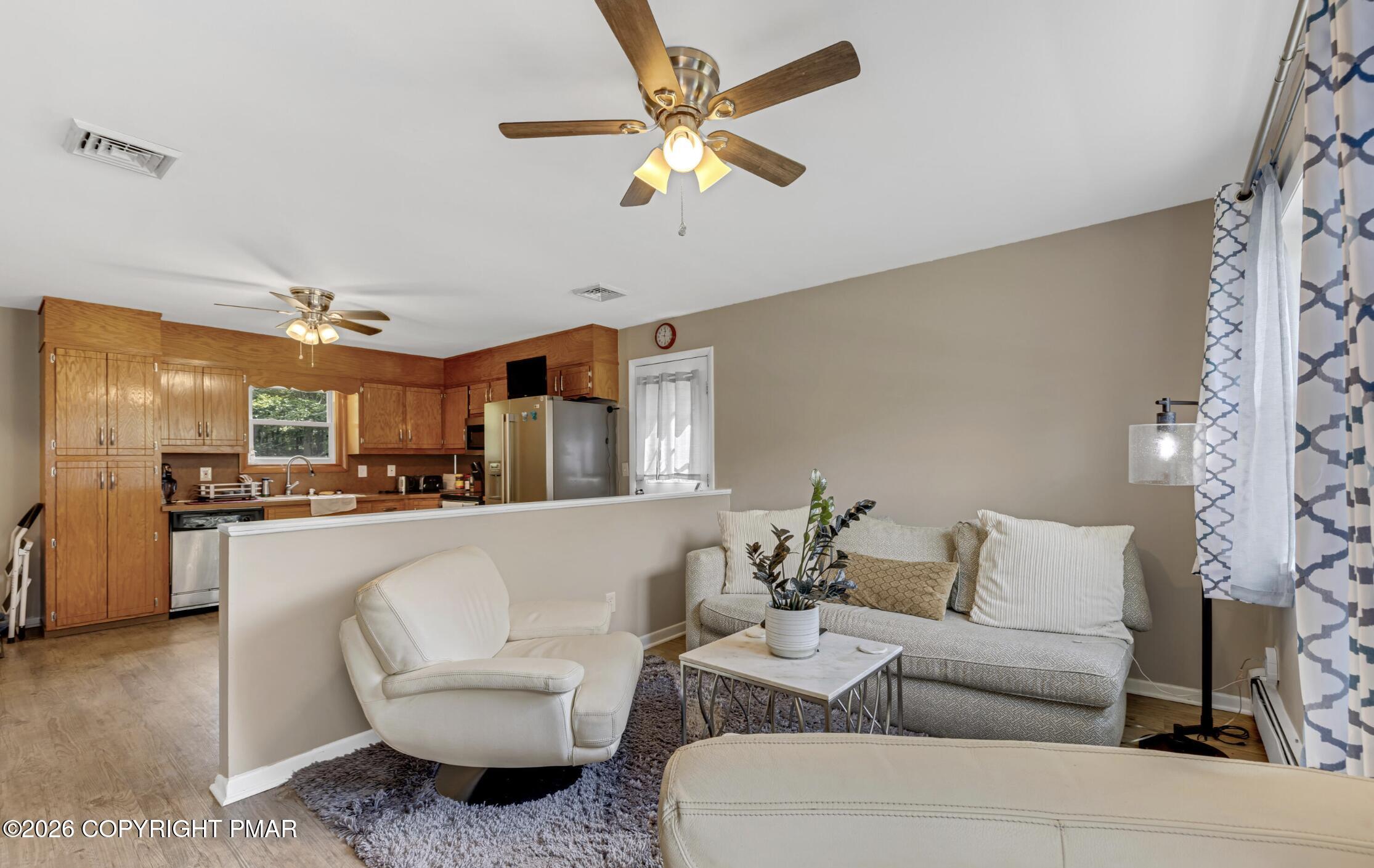 3337 Ross Road Tobyhanna, PA 18466 - Photo 2 of 10 a living room with furniture and kitchen view