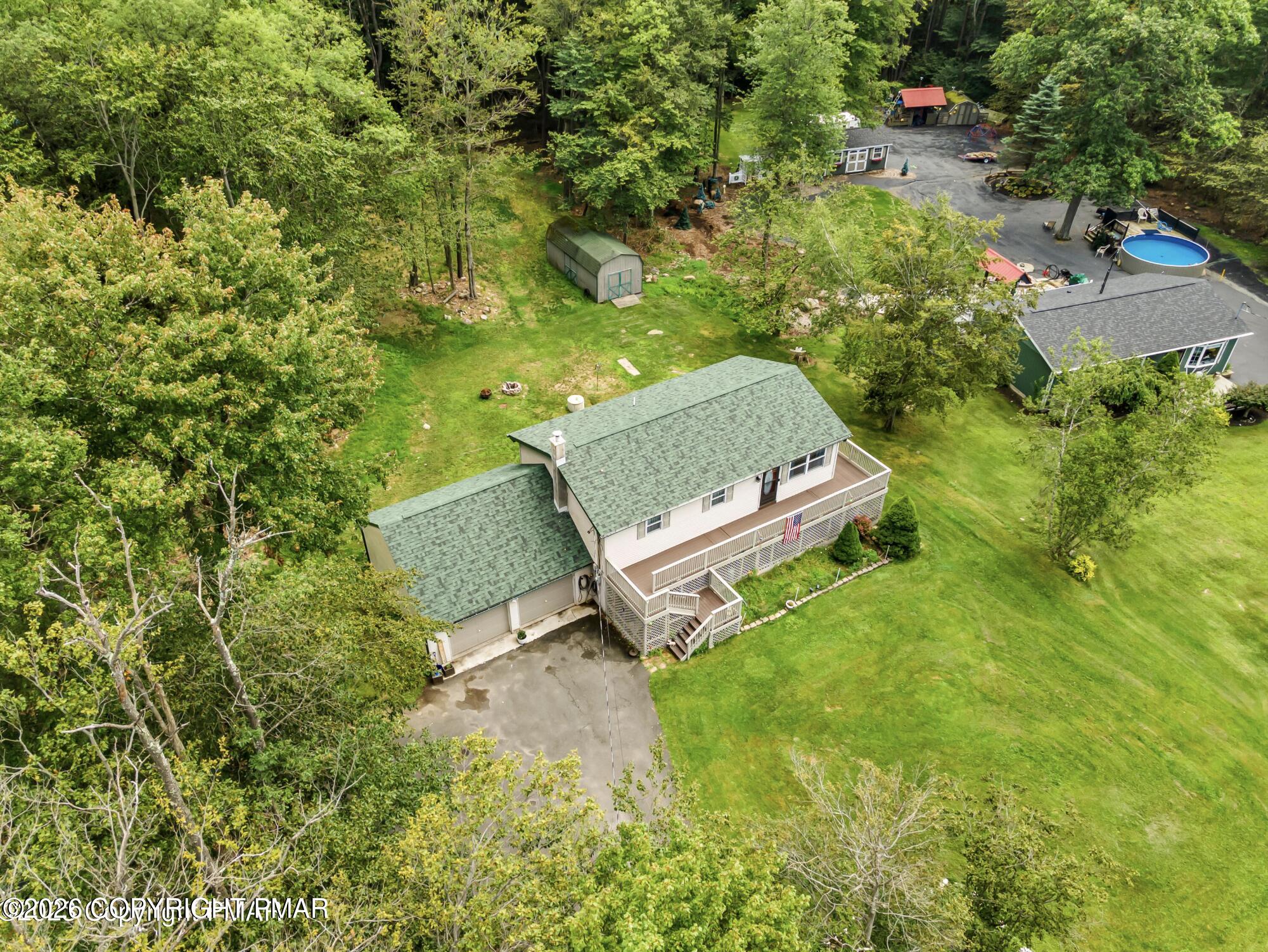 3337 Ross Road Tobyhanna, PA 18466 - Photo 10 of 10 an aerial view of a garden with a bench