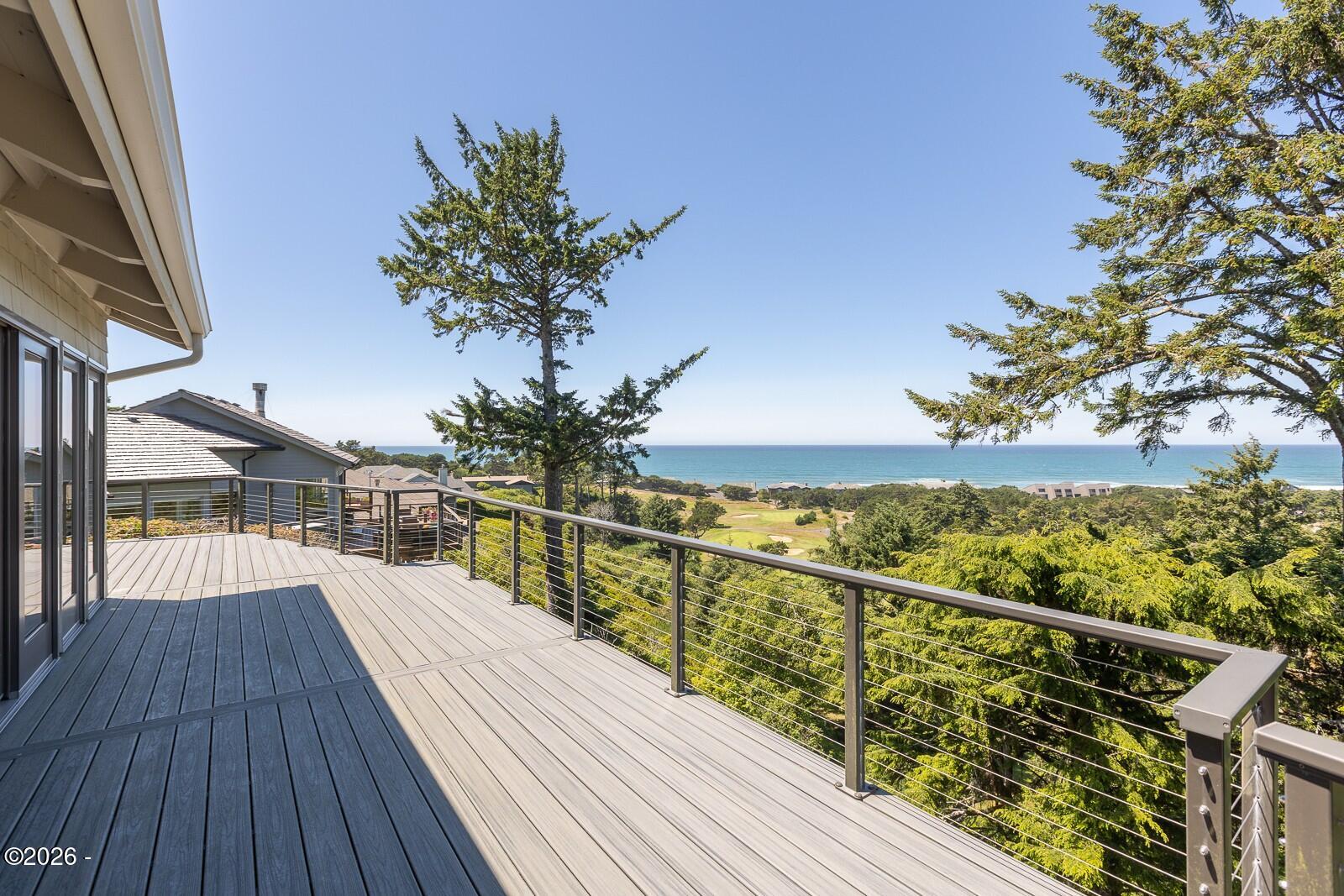 142 East Bay Point Road Gleneden Beach, OR 97388 - Photo 38 of 49 a view of balcony with wooden floor and fence