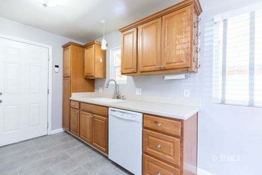240 West Graaf Avenue Ridgecrest, CA 93555 - Photo 14 of 28 a kitchen with stainless steel appliances granite countertop a sink and a window