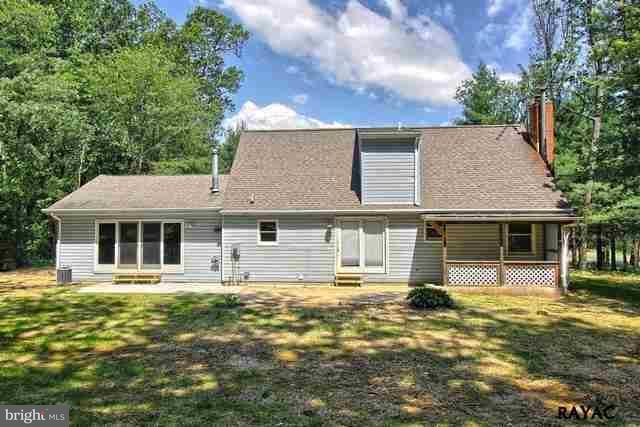7952 Hickory Road Stewartstown, PA 17363 - Photo 11 of 14 front view of a house with a yard