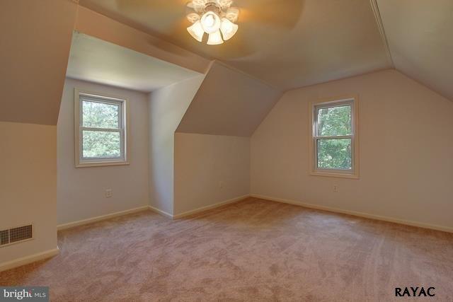7952 Hickory Road Stewartstown, PA 17363 - Photo 7 of 14 an empty room with windows and chandelier fan