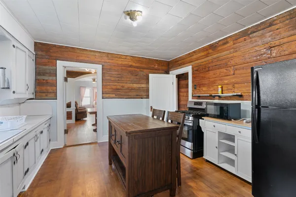 a kitchen with a sink stove and refrigerator