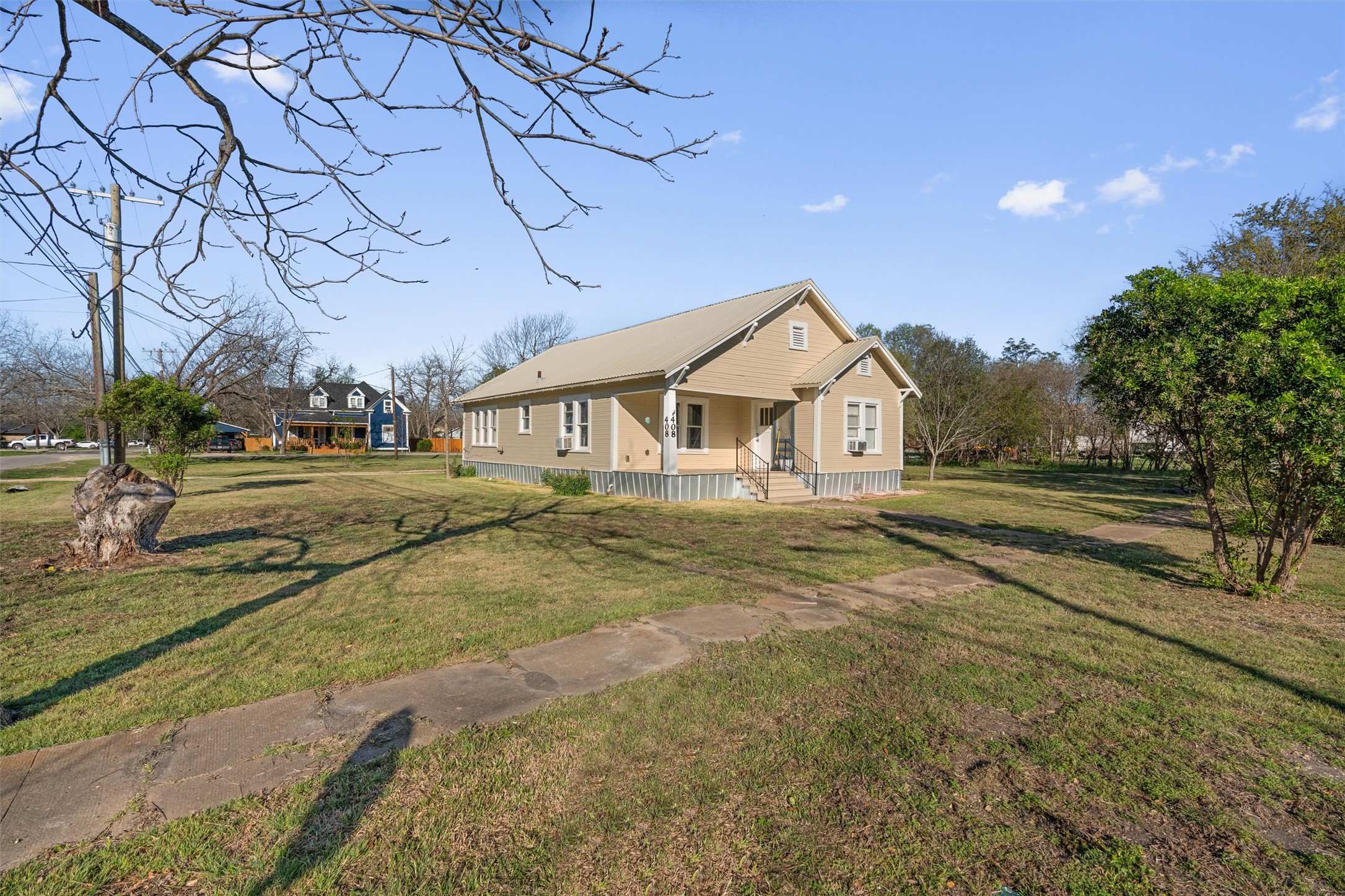 408 South Gabriel Street Granger, TX 76530 - Photo 2 of 29 a view of a house next to a road and yard