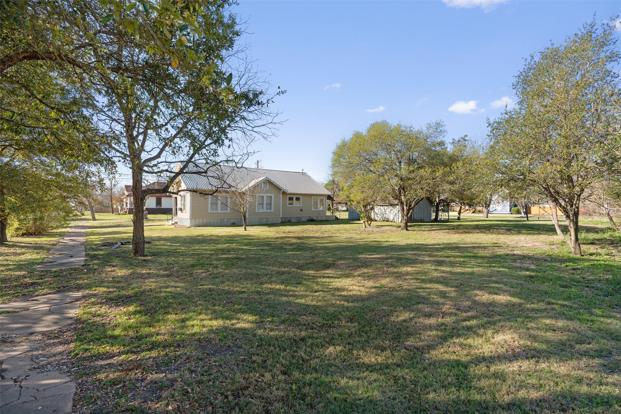 408 South Gabriel Street Granger, TX 76530 - Photo 27 of 29 a view of yard with tree and green space