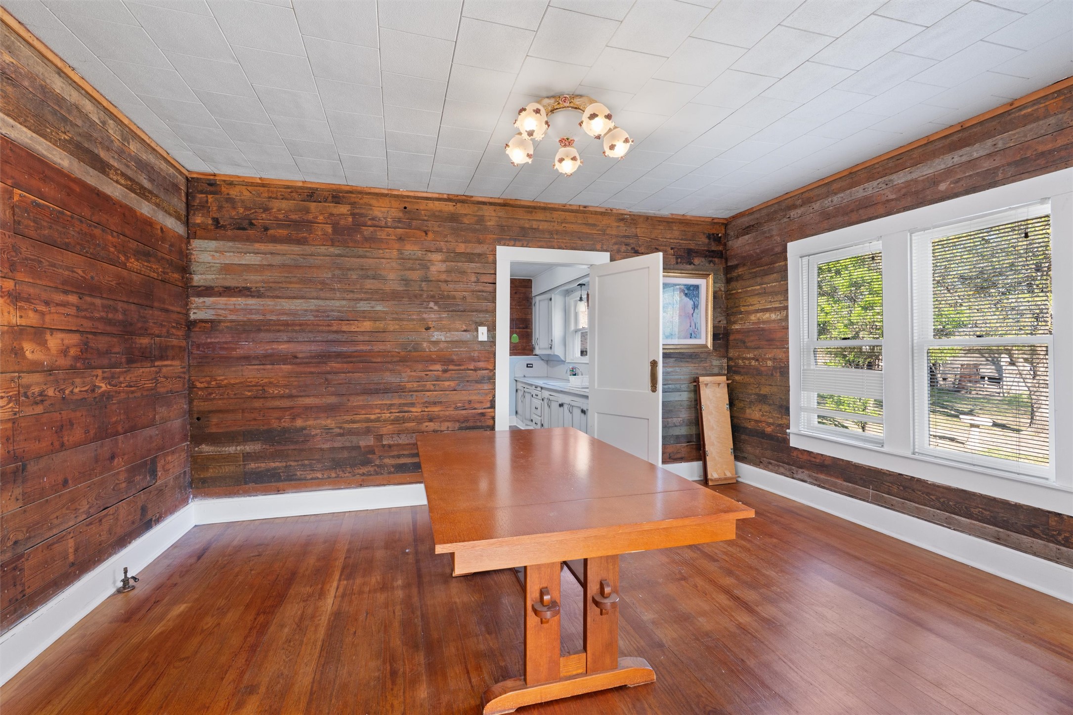 408 South Gabriel Street Granger, TX 76530 - Photo 7 of 29 a view of a dining room with furniture window and wooden floor