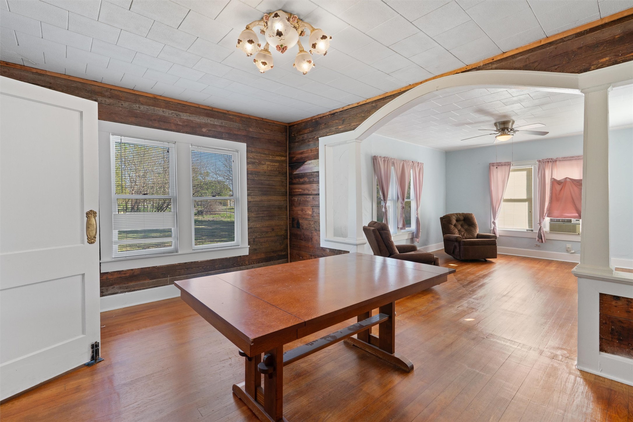 408 South Gabriel Street Granger, TX 76530 - Photo 8 of 29 a living room with furniture a table and wooden floor