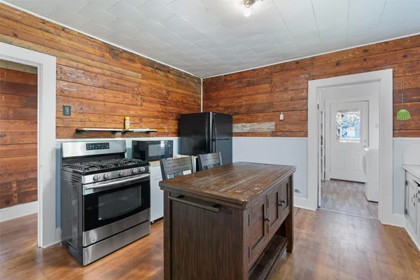 a kitchen that has a stove and a microwave