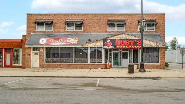 a view of a brick building with a large windows