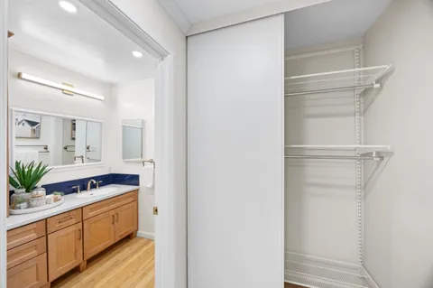 a bathroom with a double vanity sink and mirror