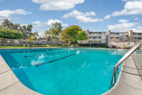 a view of a swimming pool with a yard