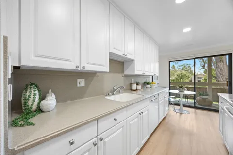 a kitchen with a sink and cabinets