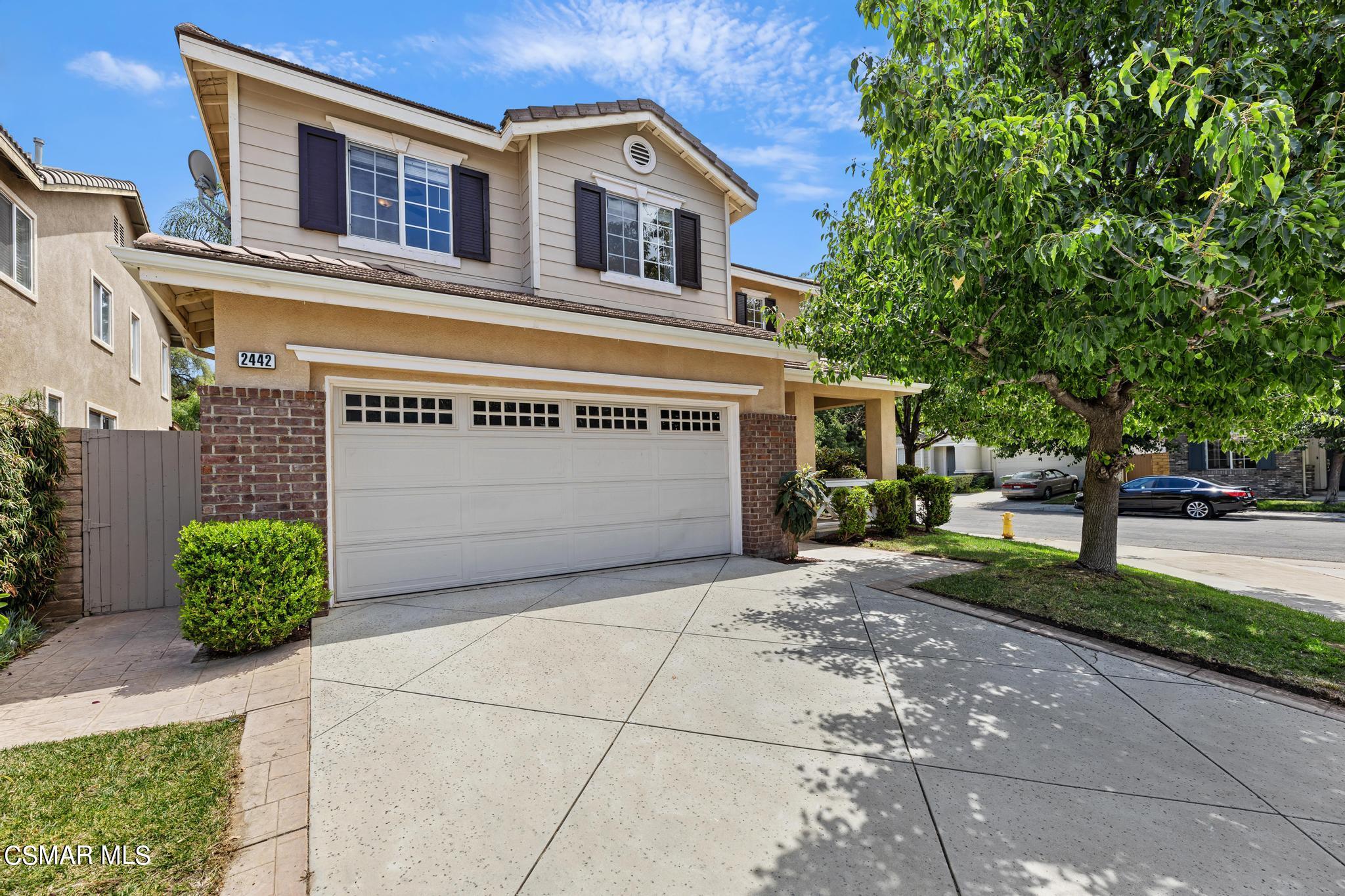 2442 Parade Avenue Simi Valley, CA 93063 - Photo 2 of 76 a front view of a house with garden