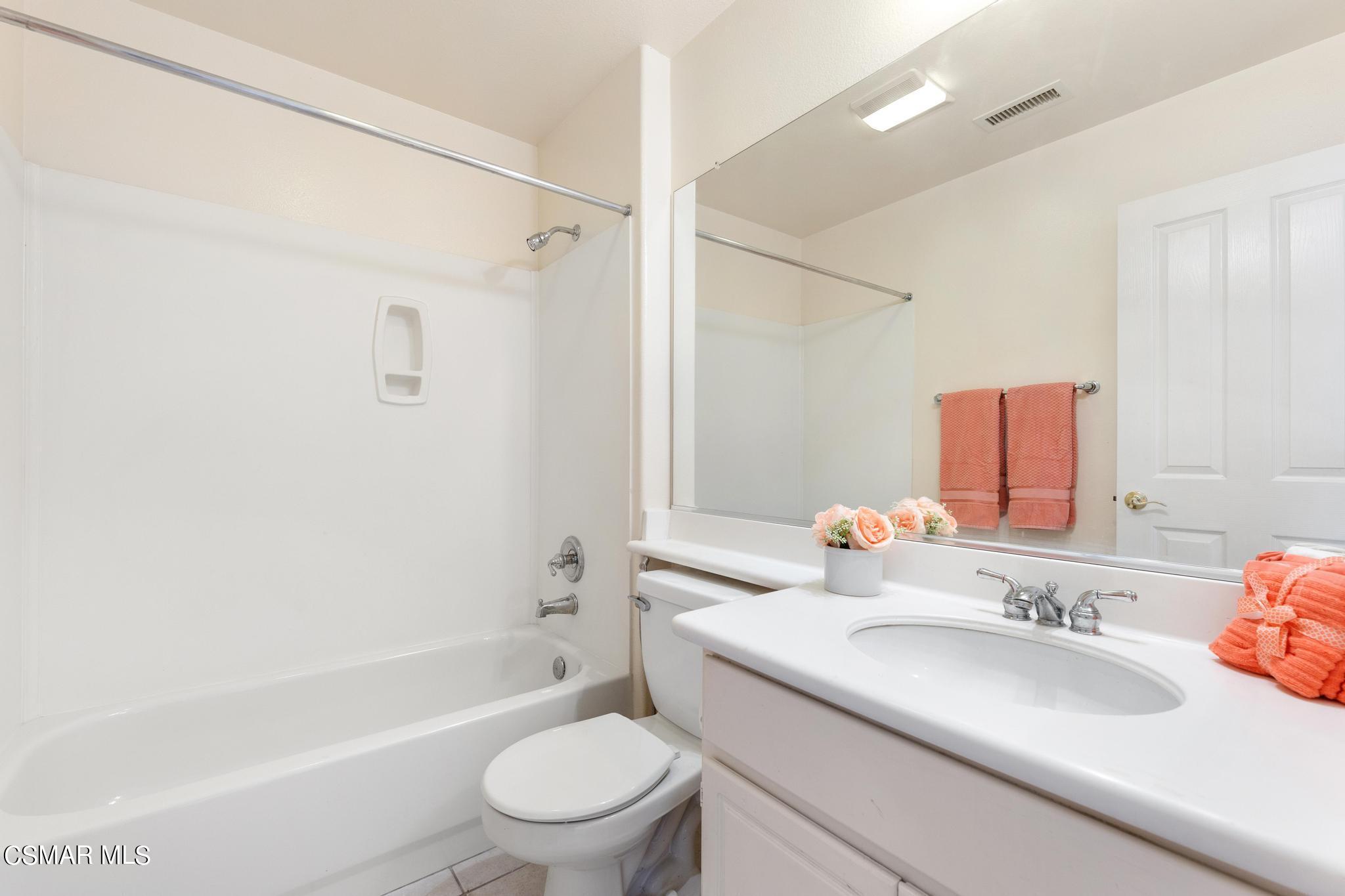 2442 Parade Avenue Simi Valley, CA 93063 - Photo 30 of 76 a bathroom with a sink toilet and shower