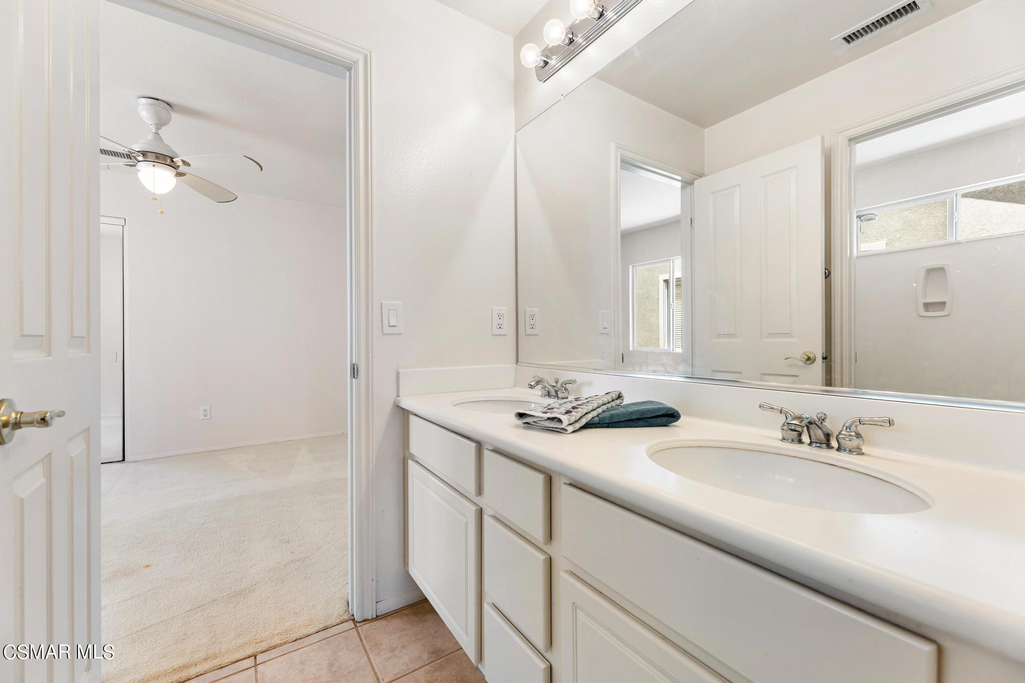 2442 Parade Avenue Simi Valley, CA 93063 - Photo 35 of 76 a bathroom with a sink and a mirror