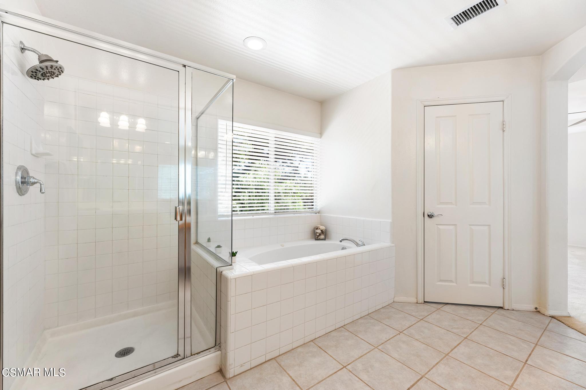 2442 Parade Avenue Simi Valley, CA 93063 - Photo 48 of 76 a bathroom with a bathtub a shower and a sink