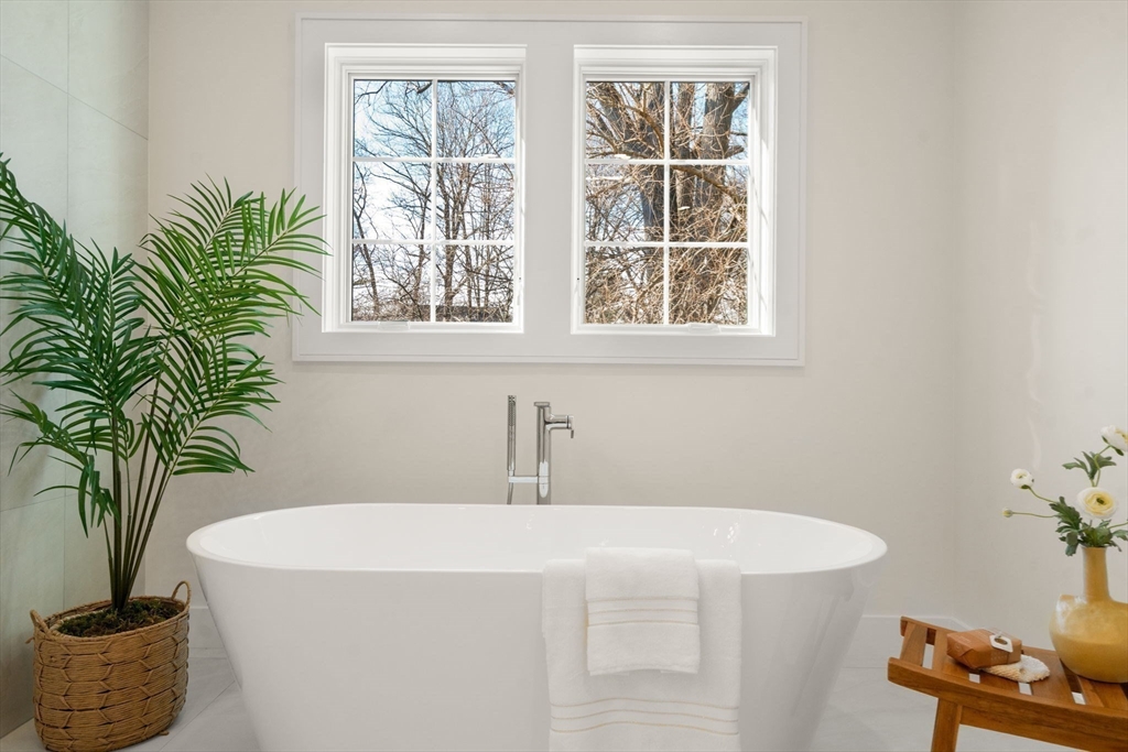 74 Gary Road Needham, MA 02494 - Photo 23 of 41 a bath tub sitting in a bathroom next to a window