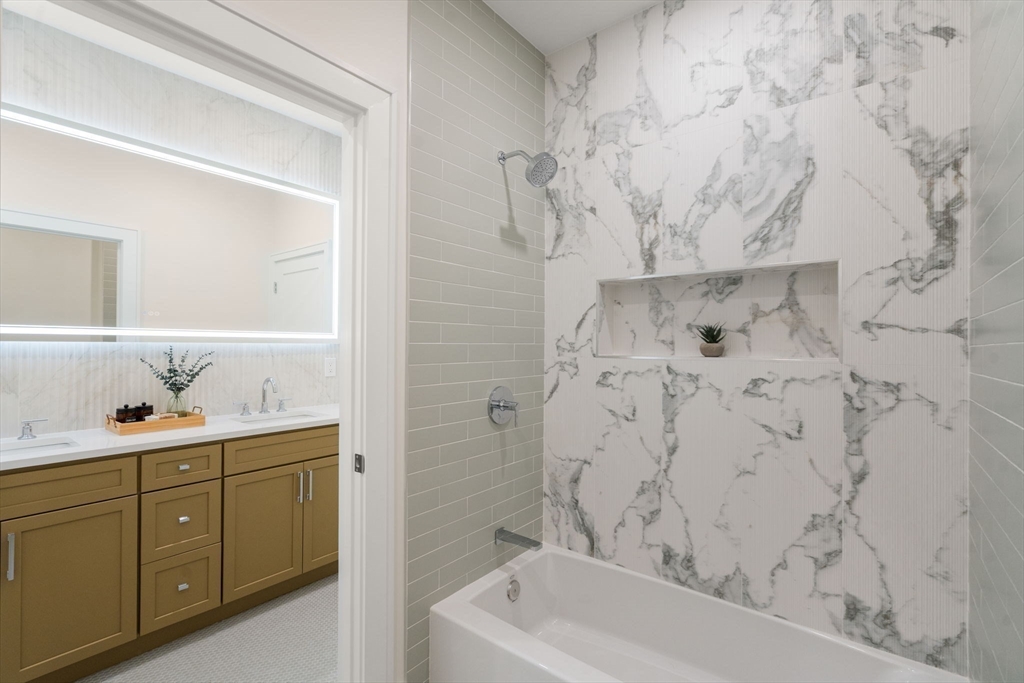 74 Gary Road Needham, MA 02494 - Photo 27 of 41 a bathroom with a bathtub sink vanity and toilet