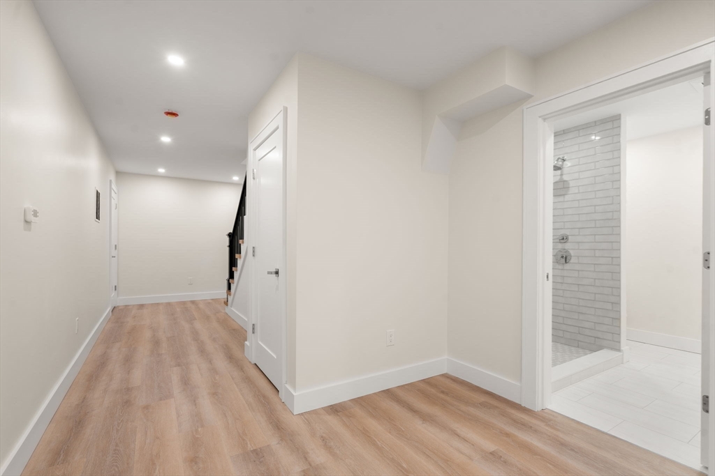 74 Gary Road Needham, MA 02494 - Photo 40 of 41 a view of hallway with wooden floor