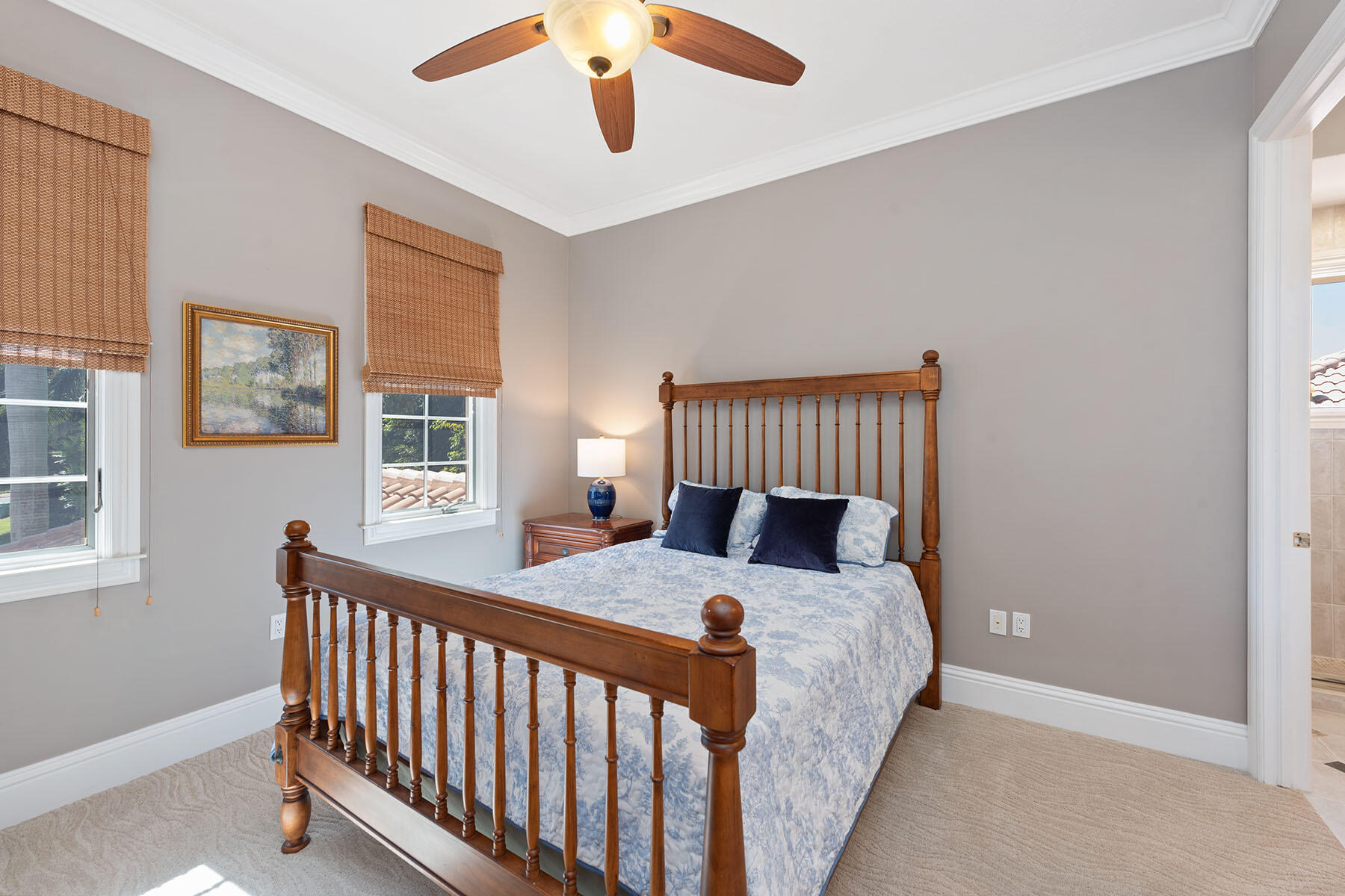 8604 Majorca Lane Naples, FL 34114 - Photo 20 of 49 a bed sitting in a bedroom next to a window